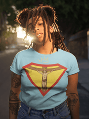 Faith, Royalty & Christian shirts for women — 'Queen' Edition T-Shirt in light blue with Christ crucifix and crown, worn outdoors with sunlight flare.